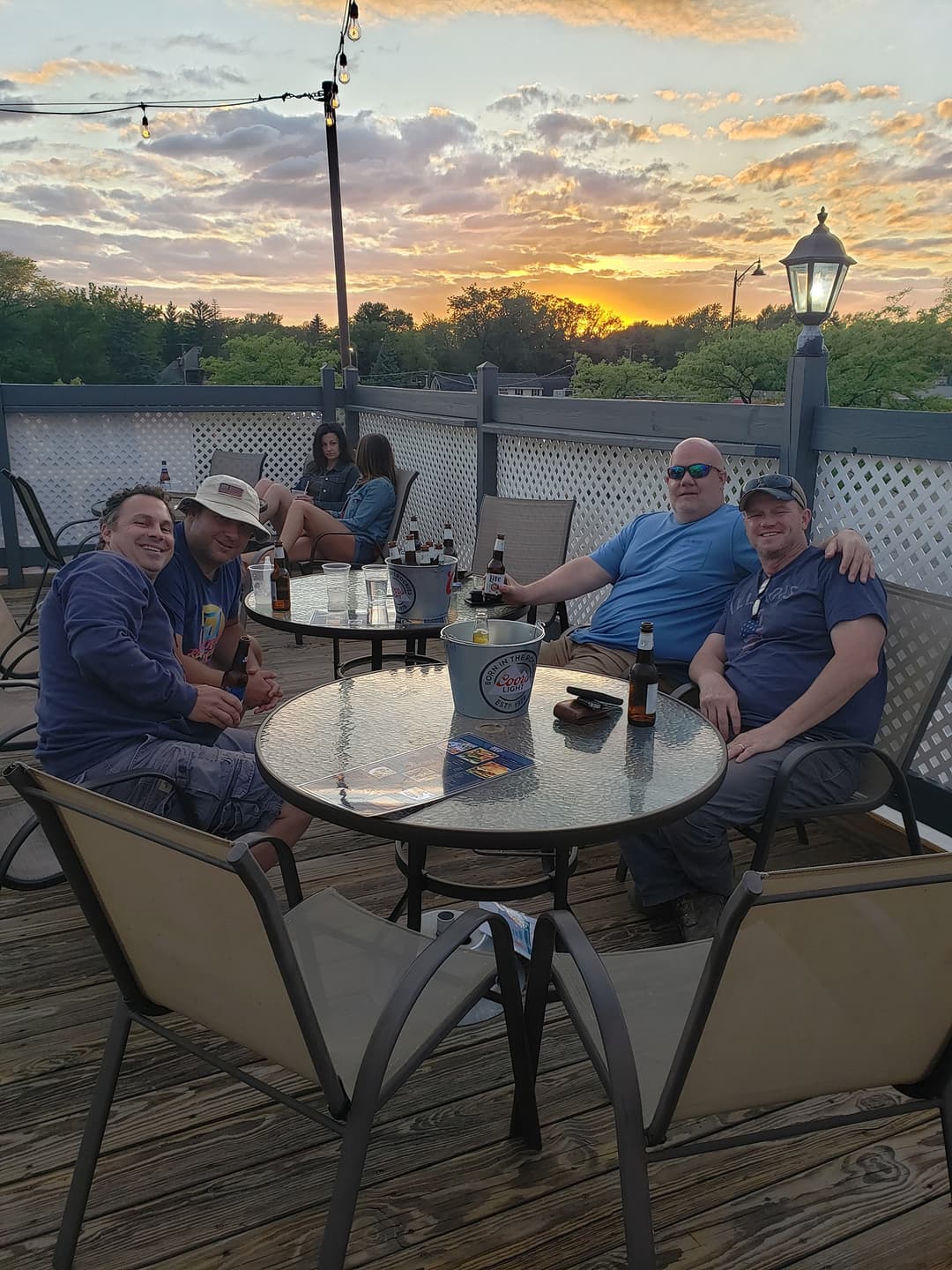 People enjoying dinner on the rooftop patio at Rooftop Johnnys Palos Heights IL