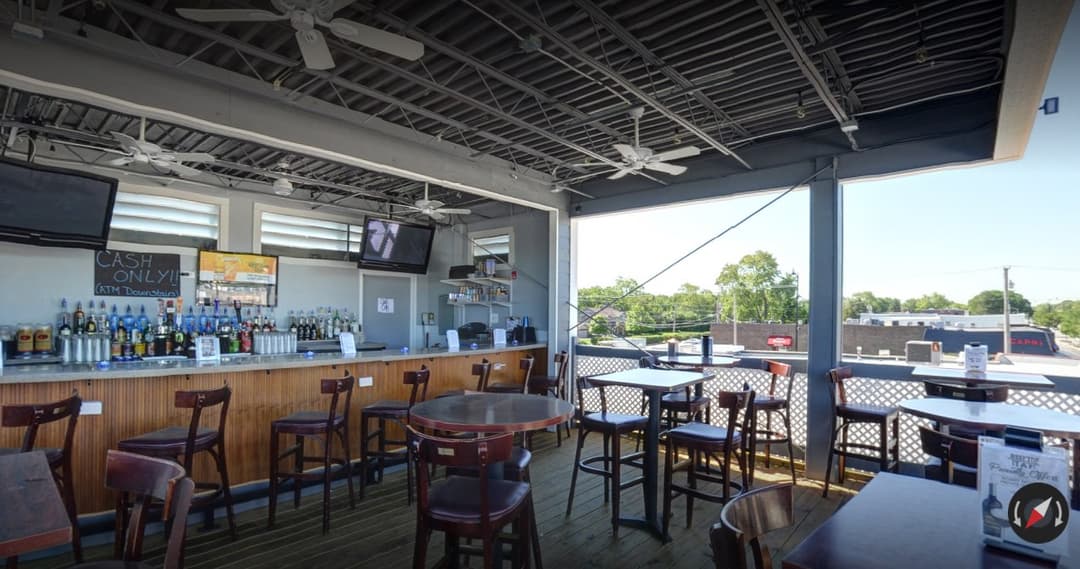 Spacious bar with cocktails and seating at Rooftop Johnnys Palos Heights IL